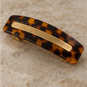Tortoiseshell acetate barrette with brass accent on pale stone